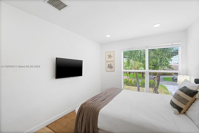 413 Holiday, Hallandale Beach, FL 33009 - bedroom featuring recessed lighting and wood finished floors