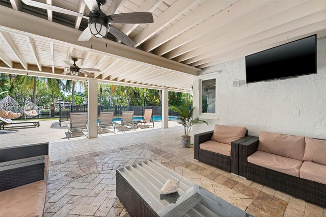 413 Holiday, Hallandale Beach, FL 33009 - fenced backyard featuring a ceiling fan, outdoor lounge area, a patio, and an outdoor pool
