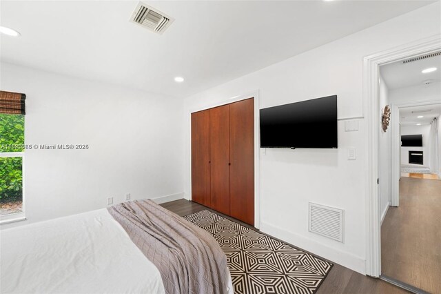 413 Holiday, Hallandale Beach, FL 33009 - bedroom featuring dark wood-type flooring, recessed lighting, and a closet