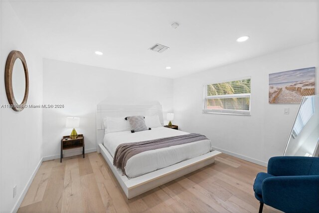 413 Holiday, Hallandale Beach, FL 33009 - bedroom featuring light wood-style floors and recessed lighting
