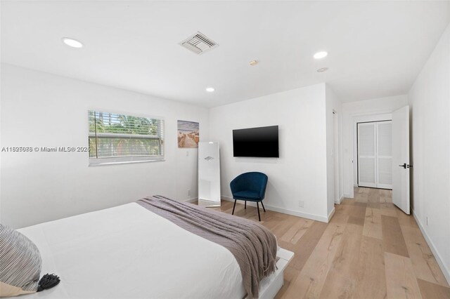 413 Holiday, Hallandale Beach, FL 33009 - bedroom featuring light wood-type flooring and recessed lighting