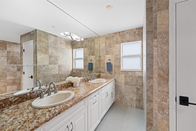413 Holiday, Hallandale Beach, FL 33009 - full bath featuring double vanity, tile walls, and tile patterned flooring