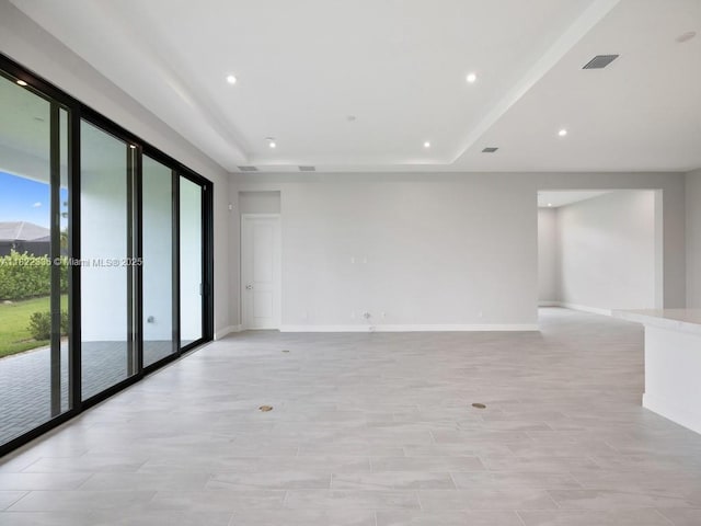 9125 SW Esule Way, Port St Lucie, FL 34987 - empty room with a tray ceiling and recessed lighting