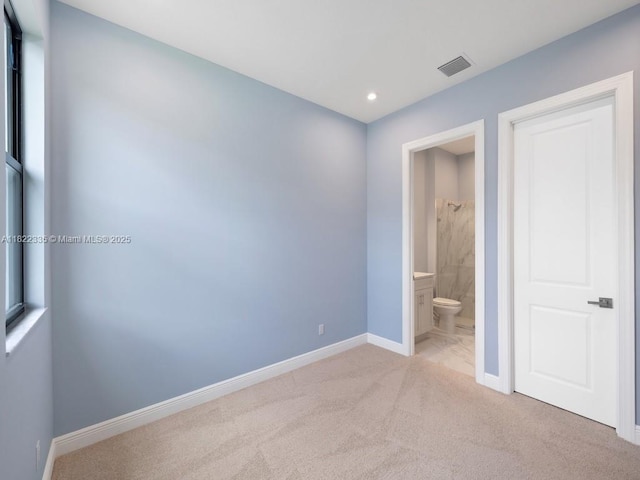 9125 SW Esule Way, Port St Lucie, FL 34987 - unfurnished bedroom with light carpet, recessed lighting, and connected bathroom