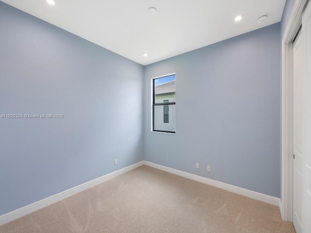 9125 SW Esule Way, Port St Lucie, FL 34987 - empty room with light carpet, recessed lighting, and a smoke detector