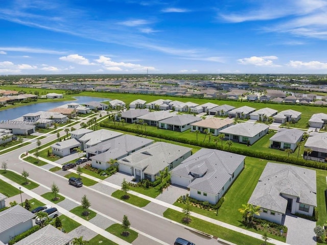 9125 SW Esule Way, Port St Lucie, FL 34987 - aerial perspective of suburban area with a nearby body of water