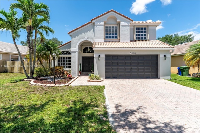 13224 NW 12th St, Pembroke Pines, FL 33028 - mediterranean / spanish-style house featuring stucco siding, a tile roof, decorative driveway, and an attached garage