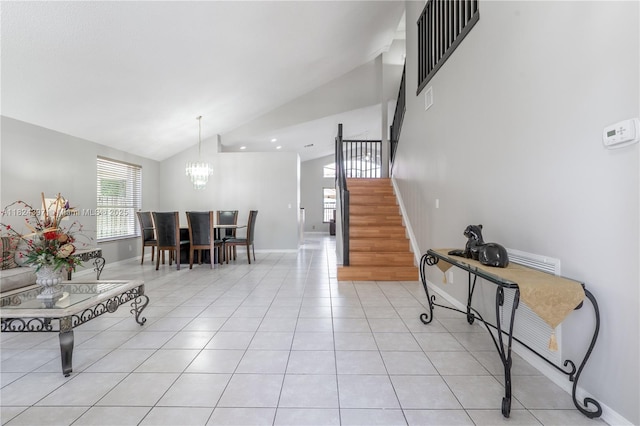 13224 NW 12th St, Pembroke Pines, FL 33028 - living room featuring stairway, a chandelier, light tile patterned flooring, and high vaulted ceiling