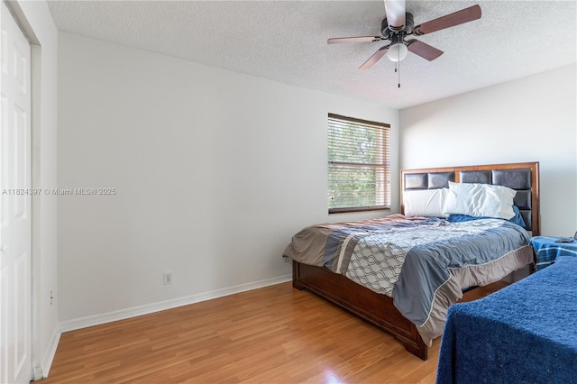 13224 NW 12th St, Pembroke Pines, FL 33028 - bedroom with wood finished floors, a textured ceiling, and a ceiling fan