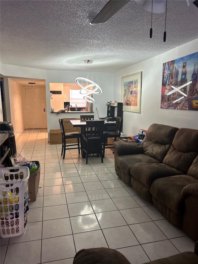 1630 W 46th St Unit 511C, Hialeah, FL 33012 - living room with light tile patterned flooring, a textured ceiling, and a chandelier