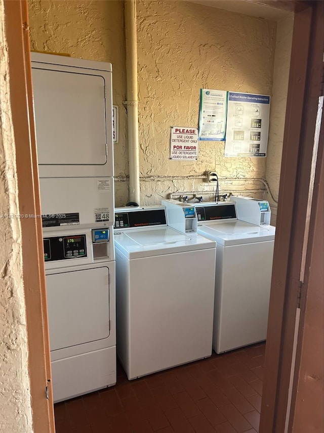 1630 W 46th St Unit 511C, Hialeah, FL 33012 - shared laundry featuring a textured wall, washing machine and clothes dryer, and stacked washer / drying machine