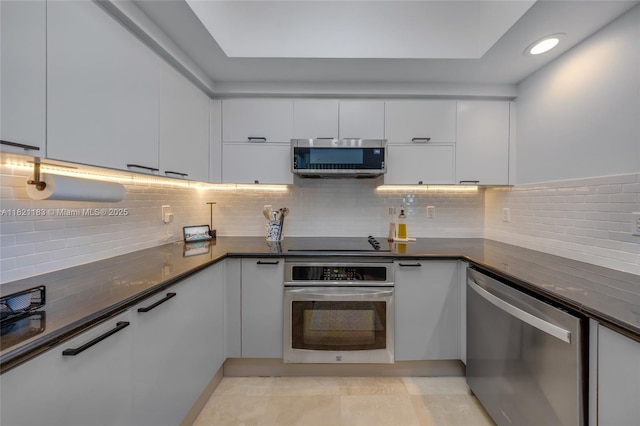 15051 Royal Oaks Ln Unit 1901, North Miami, FL 33181 - kitchen with stainless steel appliances, white cabinets, tasteful backsplash, recessed lighting, and modern cabinets