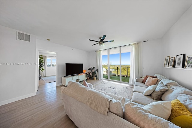 15051 Royal Oaks Ln Unit 1901, North Miami, FL 33181 - living area with light wood-type flooring and a ceiling fan