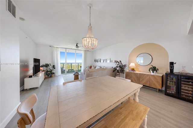 15051 Royal Oaks Ln Unit 1901, North Miami, FL 33181 - dining space featuring a chandelier and light wood-style floors
