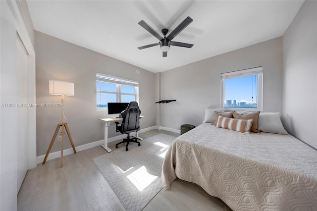 15051 Royal Oaks Ln Unit 1901, North Miami, FL 33181 - bedroom with light wood finished floors and a ceiling fan