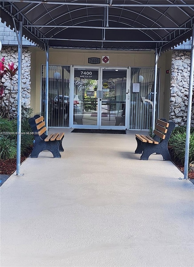 7680 NW 1st St Unit 107, Margate, FL 33063 - entrance to property with stone siding