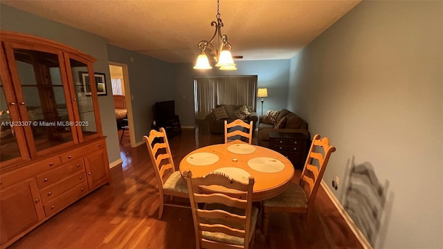 7680 NW 1st St Unit 107, Margate, FL 33063 - dining room with wood finished floors and a chandelier