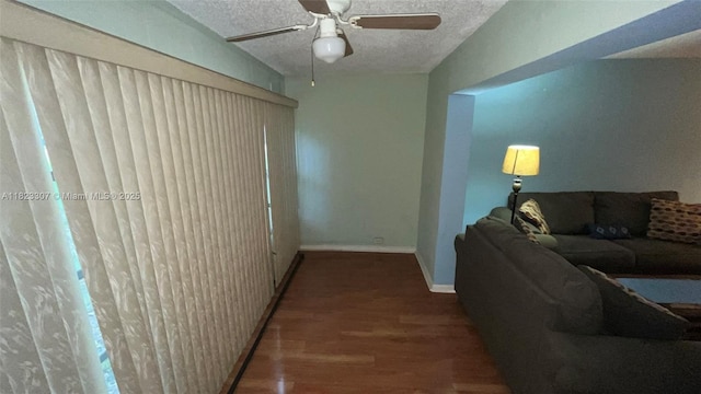 7680 NW 1st St Unit 107, Margate, FL 33063 - living room with wood finished floors, a ceiling fan, and a textured ceiling
