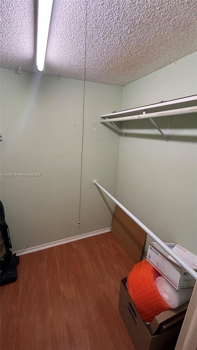 7680 NW 1st St Unit 107, Margate, FL 33063 - spacious closet with wood finished floors