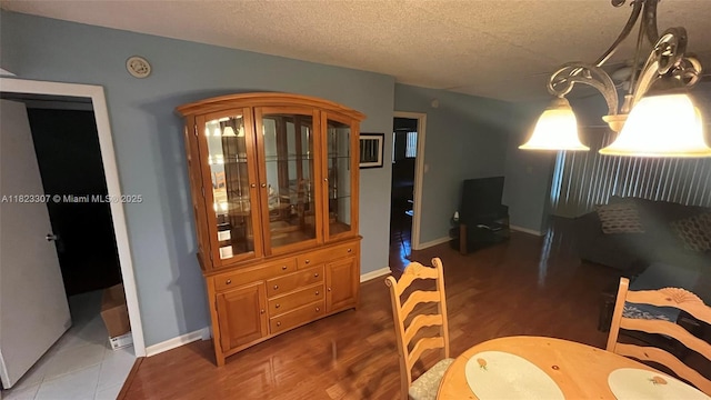 7680 NW 1st St Unit 107, Margate, FL 33063 - dining room with a textured ceiling and wood finished floors