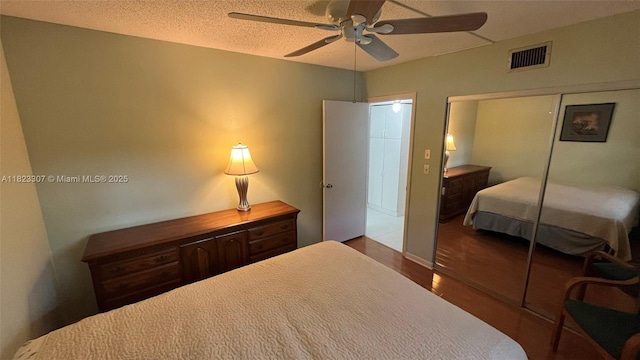 7680 NW 1st St Unit 107, Margate, FL 33063 - bedroom with wood finished floors, a closet, and a ceiling fan