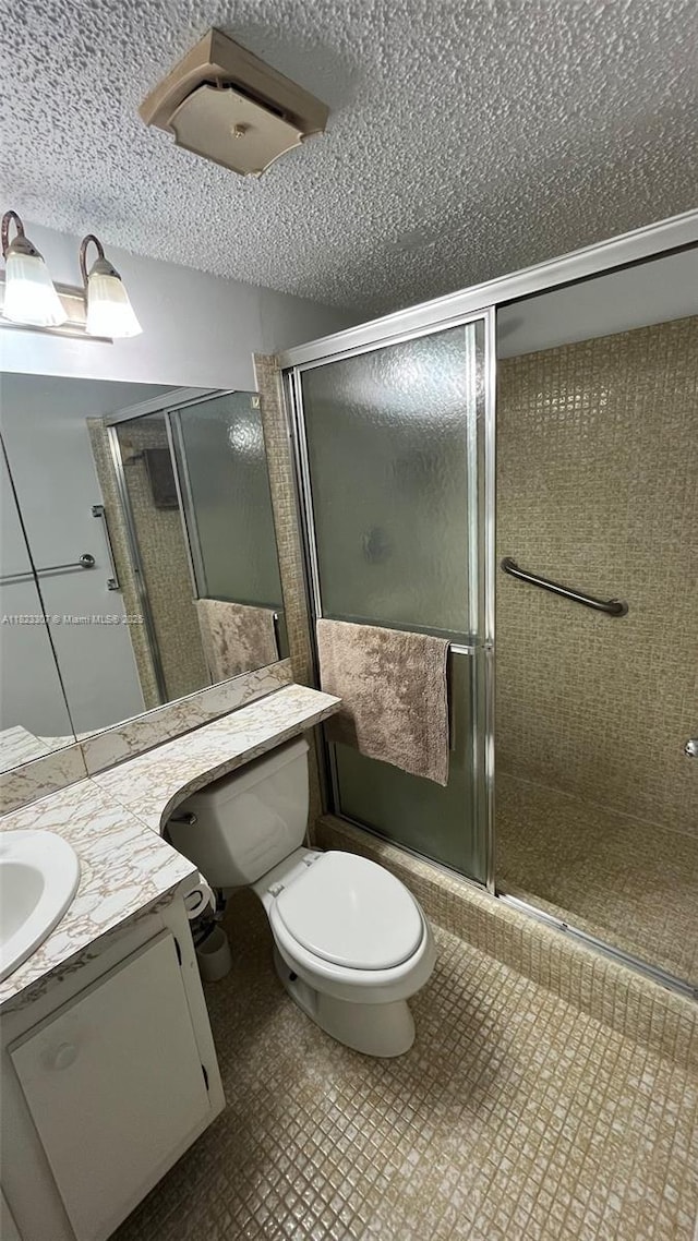 7680 NW 1st St Unit 107, Margate, FL 33063 - bathroom with vanity, a stall shower, and a textured ceiling