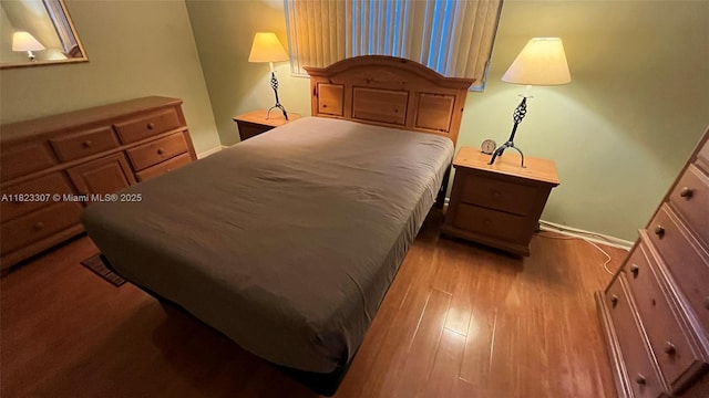 7680 NW 1st St Unit 107, Margate, FL 33063 - bedroom featuring wood finished floors