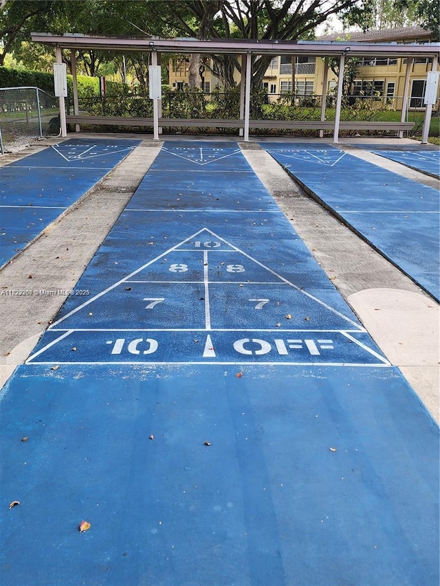 7680 NW 1st St Unit 107, Margate, FL 33063 - view of community with uncovered parking and shuffleboard