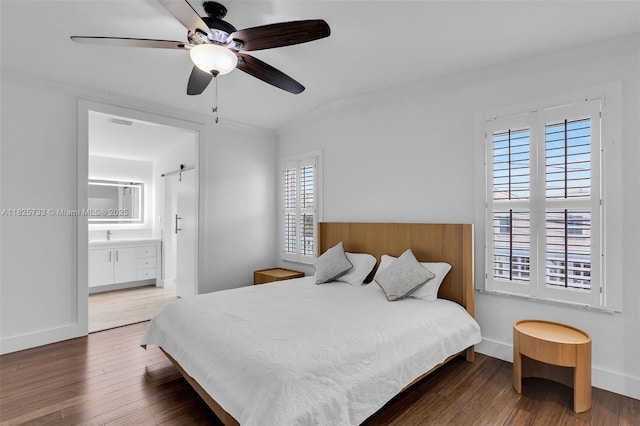 103 Long Key Rd, Key Largo, FL 33037 - bedroom with multiple windows, wood finished floors, crown molding, ensuite bathroom, and ceiling fan