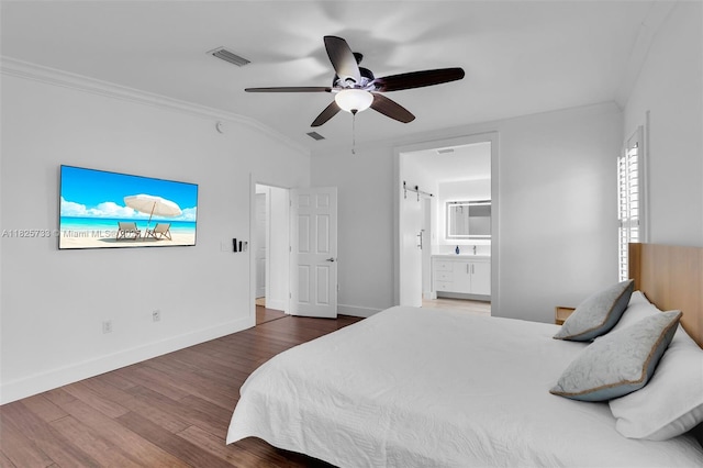 103 Long Key Rd, Key Largo, FL 33037 - bedroom with crown molding, wood finished floors, ensuite bathroom, and ceiling fan