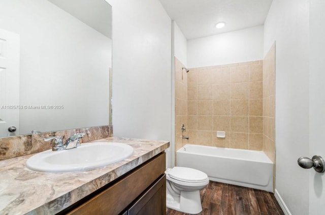 485 SW Molloy St, Port St Lucie, FL 34984 - bathroom with wood finished floors, vanity, and washtub / shower combination