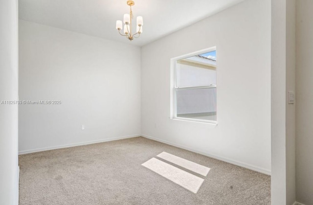 485 SW Molloy St, Port St Lucie, FL 34984 - spare room featuring carpet and a chandelier