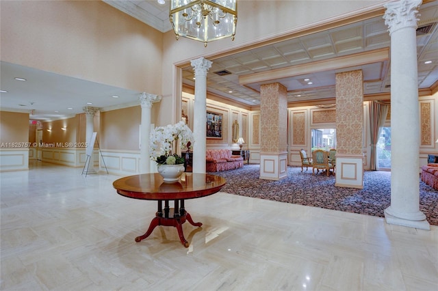 2500 Parkview Dr Unit 405, Hallandale Beach, FL 33009 - common area with a decorative wall, ornamental molding, a wainscoted wall, and a high ceiling