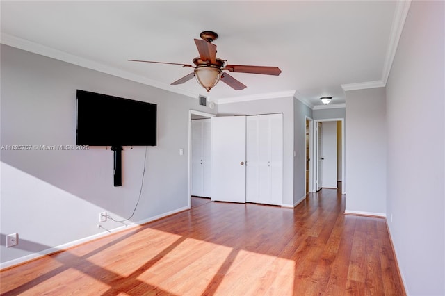 2500 Parkview Dr Unit 405, Hallandale Beach, FL 33009 - unfurnished bedroom with wood finished floors, ornamental molding, a closet, and a ceiling fan