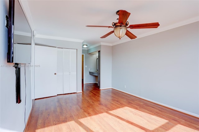2500 Parkview Dr Unit 405, Hallandale Beach, FL 33009 - unfurnished bedroom featuring wood finished floors, crown molding, a closet, and ceiling fan