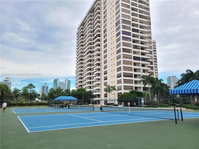 2500 Parkview Dr Unit 405, Hallandale Beach, FL 33009 - view of tennis court featuring a city view and community basketball court