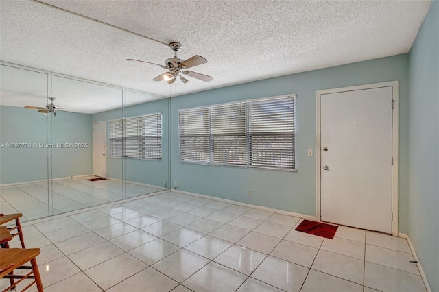13155 SW 7th Ct Unit 308E, Pembroke Pines, FL 33027 - unfurnished room featuring ceiling fan, light tile patterned floors, and a textured ceiling