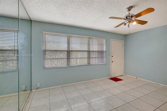 13155 SW 7th Ct Unit 308E, Pembroke Pines, FL 33027 - empty room with ceiling fan, a textured ceiling, and tile patterned floors