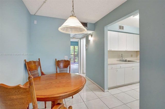 13155 SW 7th Ct Unit 308E, Pembroke Pines, FL 33027 - dining space with light tile patterned floors and baseboards