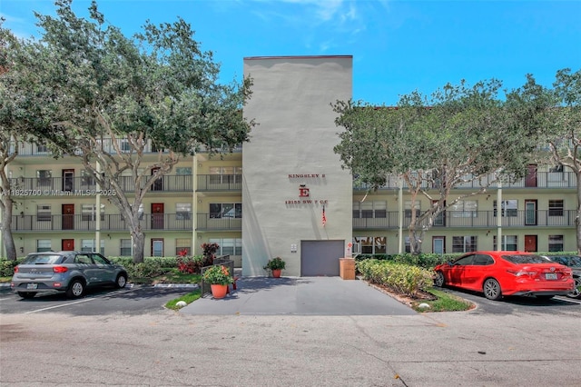 13155 SW 7th Ct Unit 308E, Pembroke Pines, FL 33027 - view of property with uncovered parking