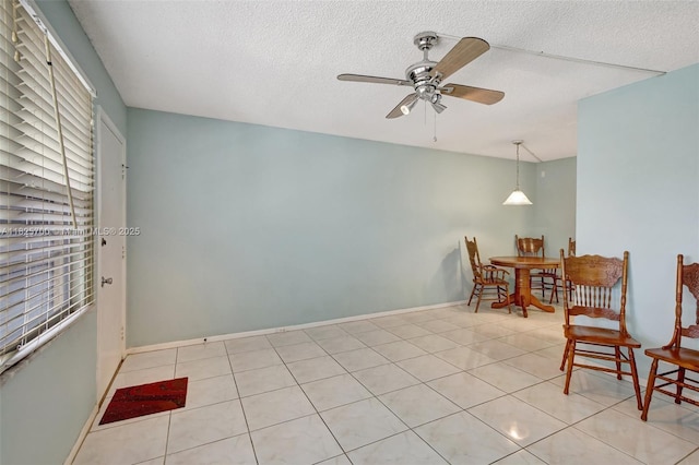 13155 SW 7th Ct Unit 308E, Pembroke Pines, FL 33027 - dining room featuring a ceiling fan, tile patterned floors, and a textured ceiling