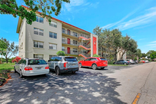 13155 SW 7th Ct Unit 308E, Pembroke Pines, FL 33027 - view of apartment building / complex with uncovered parking