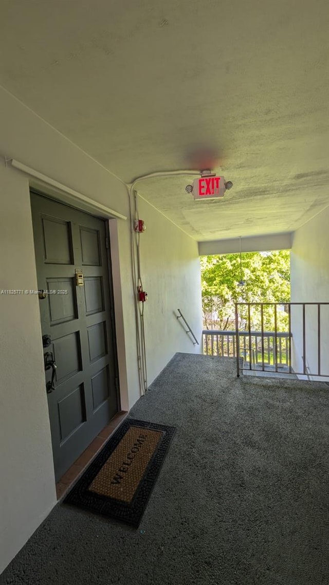1001 Hillcrest Ct Unit 303, Hollywood, FL 33021 - view of exterior entry featuring covered porch and stucco siding