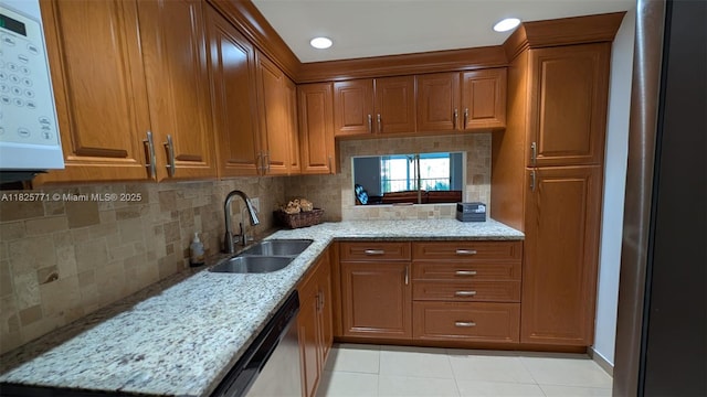 1001 Hillcrest Ct Unit 303, Hollywood, FL 33021 - kitchen featuring dishwasher, brown cabinetry, light tile patterned floors, light stone counters, and recessed lighting