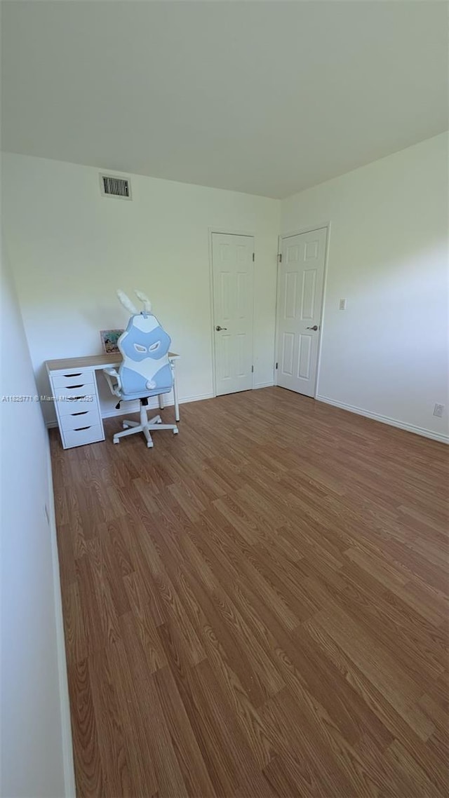 1001 Hillcrest Ct Unit 303, Hollywood, FL 33021 - unfurnished room with wood finished floors