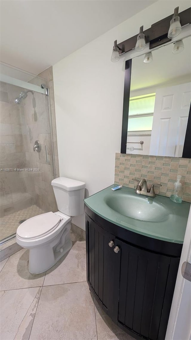 1001 Hillcrest Ct Unit 303, Hollywood, FL 33021 - full bathroom featuring vanity, a shower stall, decorative backsplash, and tile patterned floors