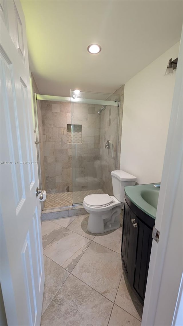 1001 Hillcrest Ct Unit 303, Hollywood, FL 33021 - bathroom featuring vanity, a shower stall, recessed lighting, and tile patterned floors
