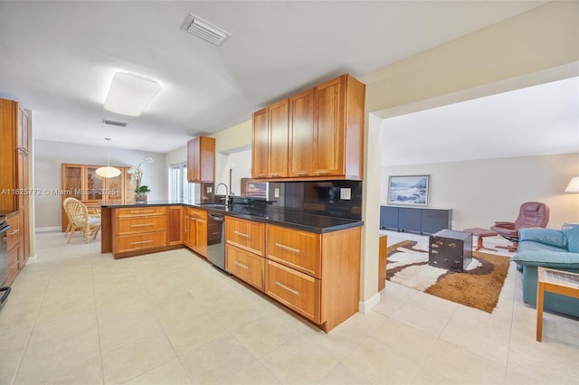 10220 SW 108th St, Miami, FL 33176 - kitchen featuring dishwasher, open floor plan, a peninsula, brown cabinets, and dark countertops
