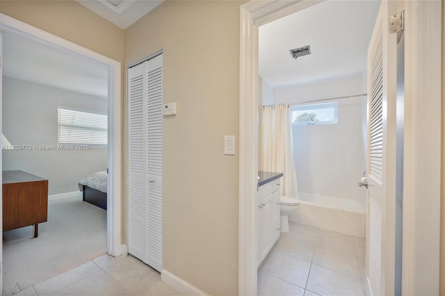 10220 SW 108th St, Miami, FL 33176 - hallway featuring light tile patterned floors and baseboards