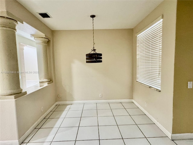 1379 NW 166th Ave, Pembroke Pines, FL 33028 - unfurnished dining area featuring decorative columns, light tile patterned floors, and plenty of natural light